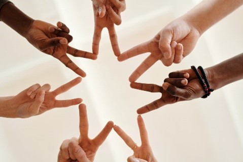 Restorative Practices. Decorative image of hands forming a star with fingers.